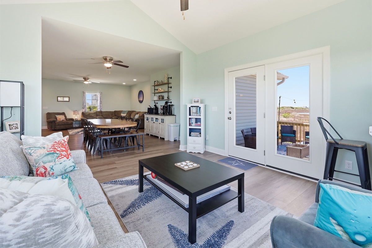 Open flow from living to dining with coffee bar ready for mornings