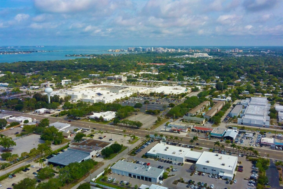 North-northwestward aerial view above the home with views of Lido Key and downtown Sarasota.