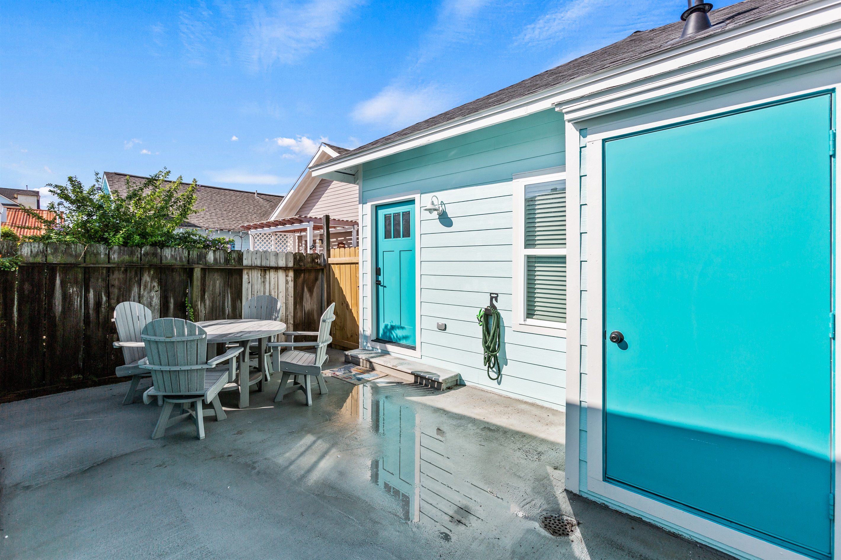 Private back yard with hose to rinse off sand after a day at the beach!