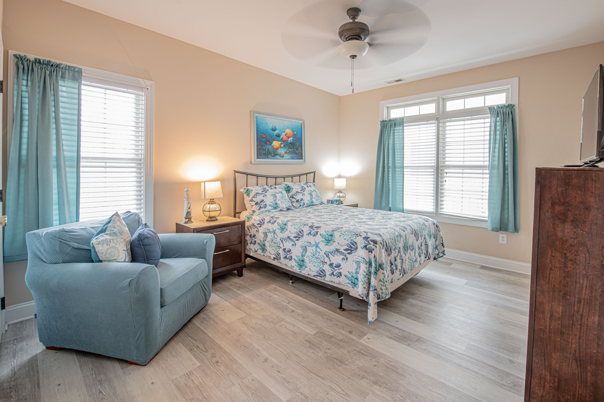 Bedroom 2 with  Armchair, and Ceiling Fan