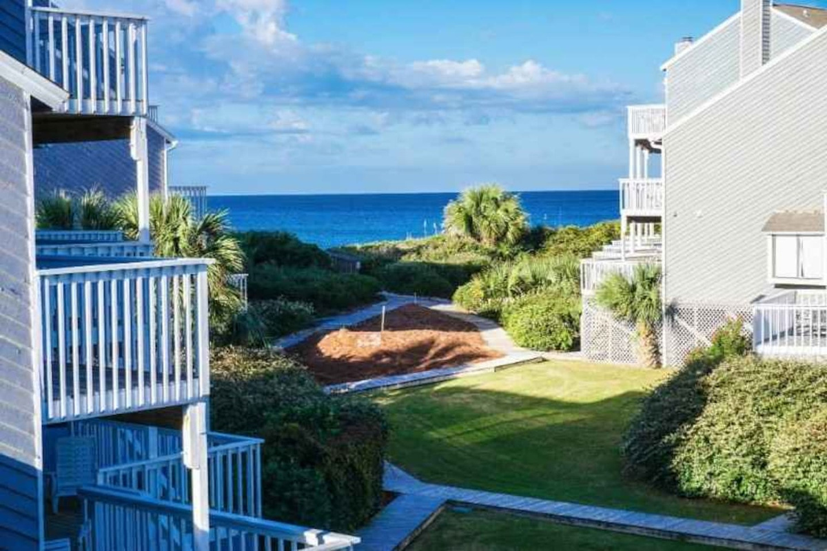 Step outside and take it all in &mdash; your multi-story Gulf-view townhome with layered decks, lush landscaping, and the water already waiting.