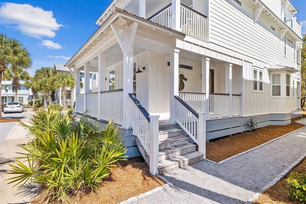 Bright 3-story home with separate carriage house, multiple porches and walkable access to the beach, pool, green space, restaurants and shops.