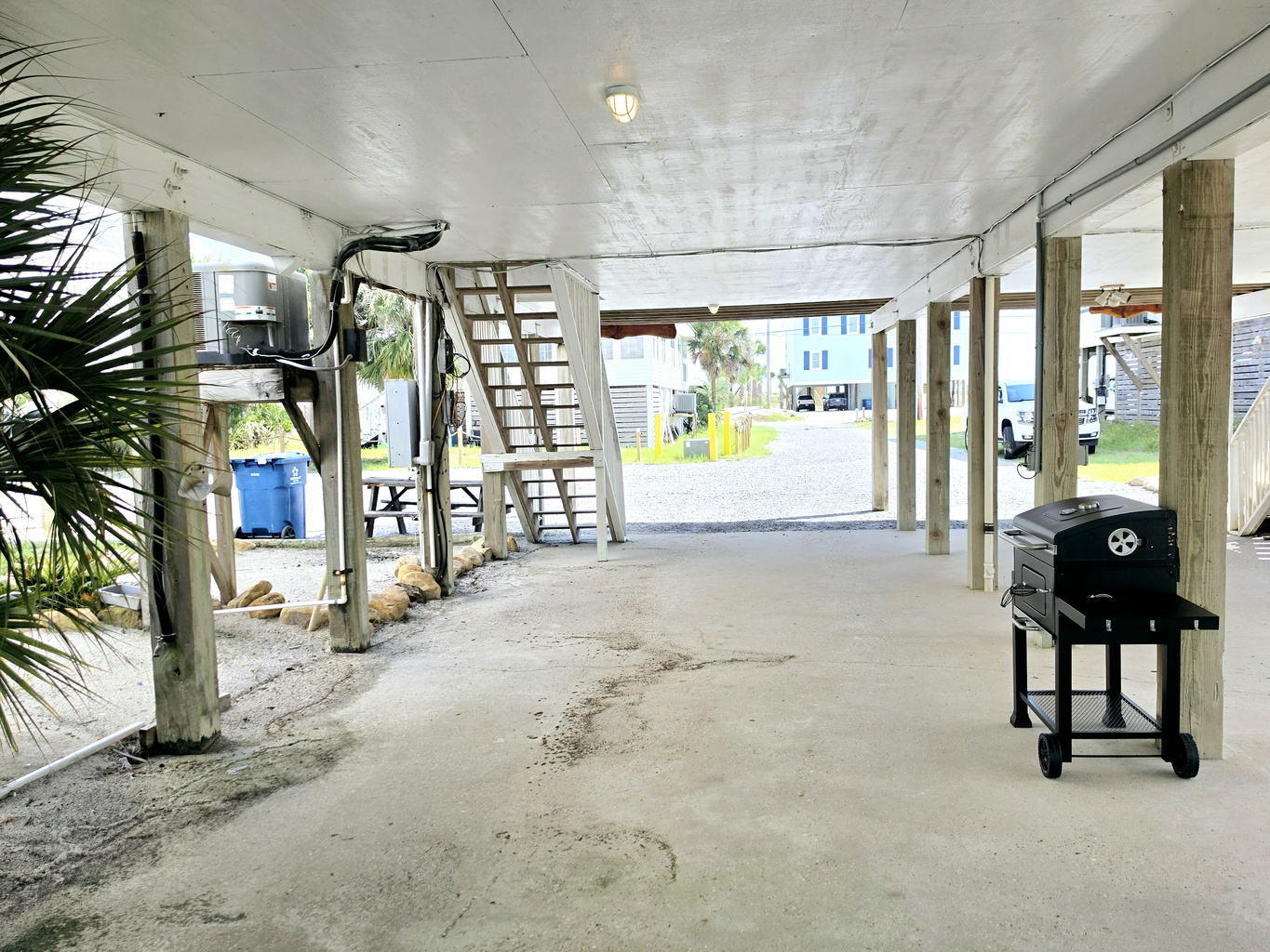 Covered parking with stairs up to the unit