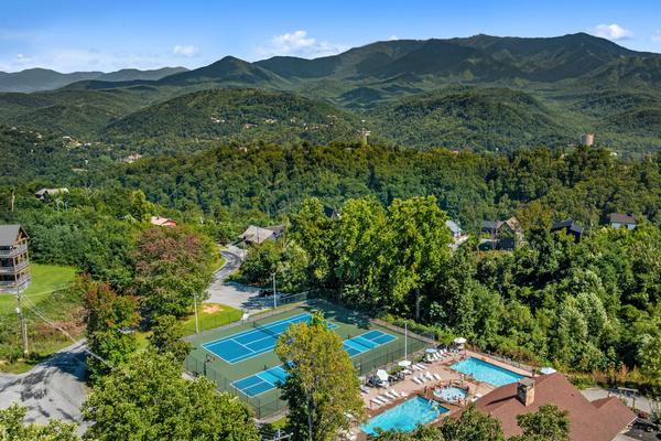 Shared Chalet Village pools, tennis court, and pickleball courts with Smoky Mountain views