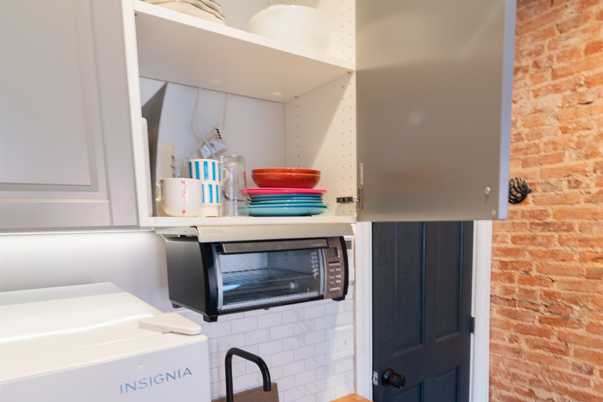 Ensuite Kitchenette. Equipped with toaster/convection oven, microwave, utensils, silverware, pot/pans, electric double cook top, refrigerator/freezer, sink.