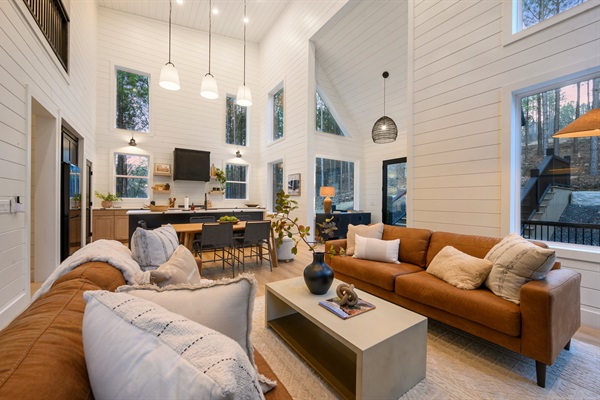 The open-concept living, dining, and kitchen area is perfect for relaxing and reconnecting.