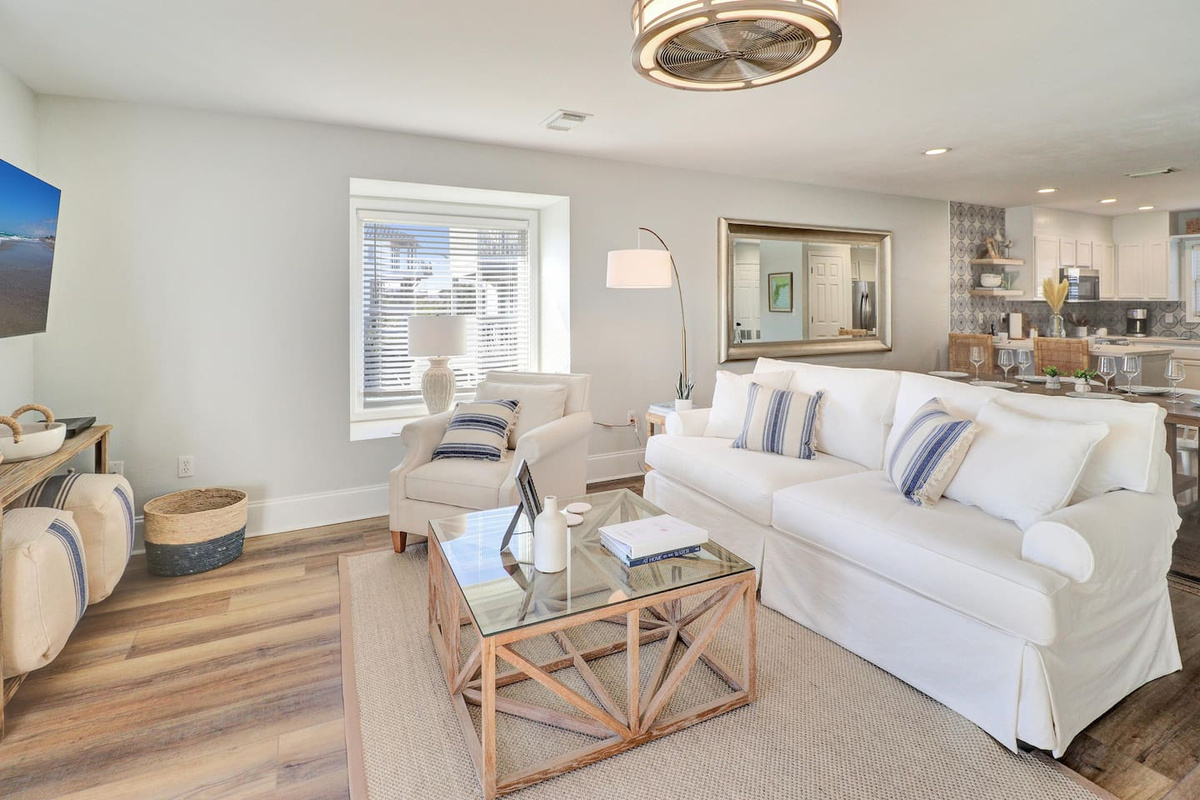 Settle into the main living area where Gulf light pours through every window.