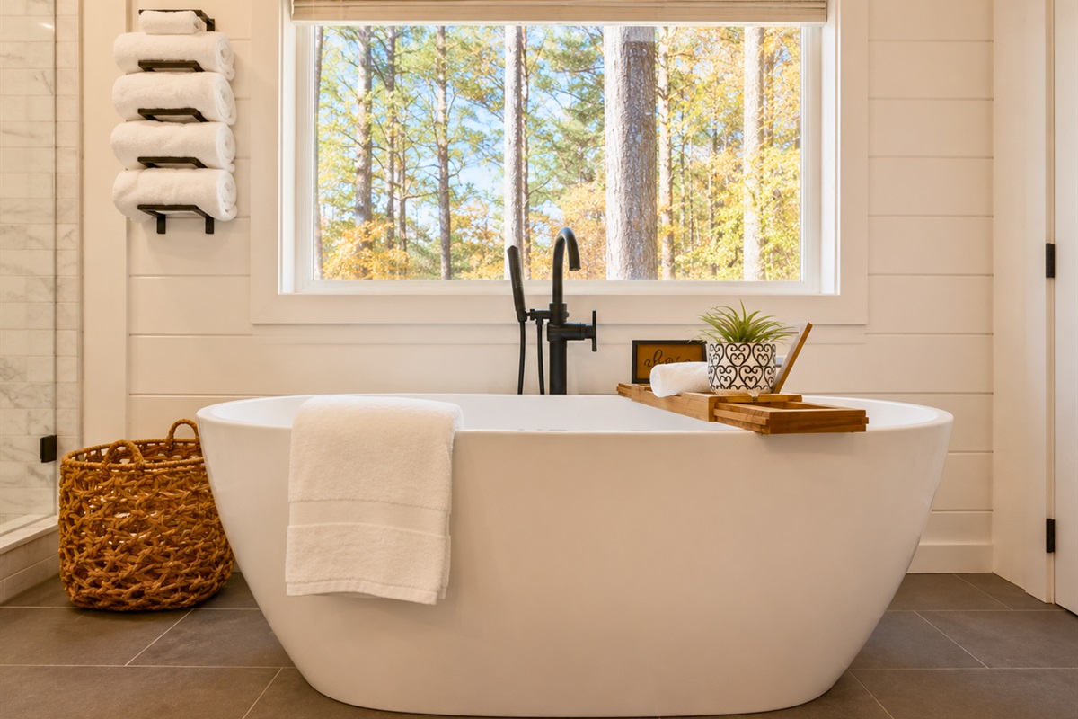 Soak in the freestanding tub while taking in peaceful wooded views just outside the window for the ultimate relaxing evening.