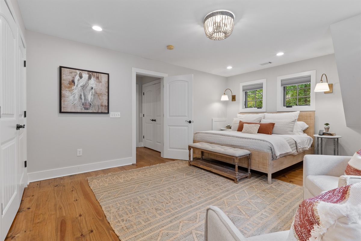 The second bedroom features a king bed with premium bedding, providing a comfortable and restful space for guests.