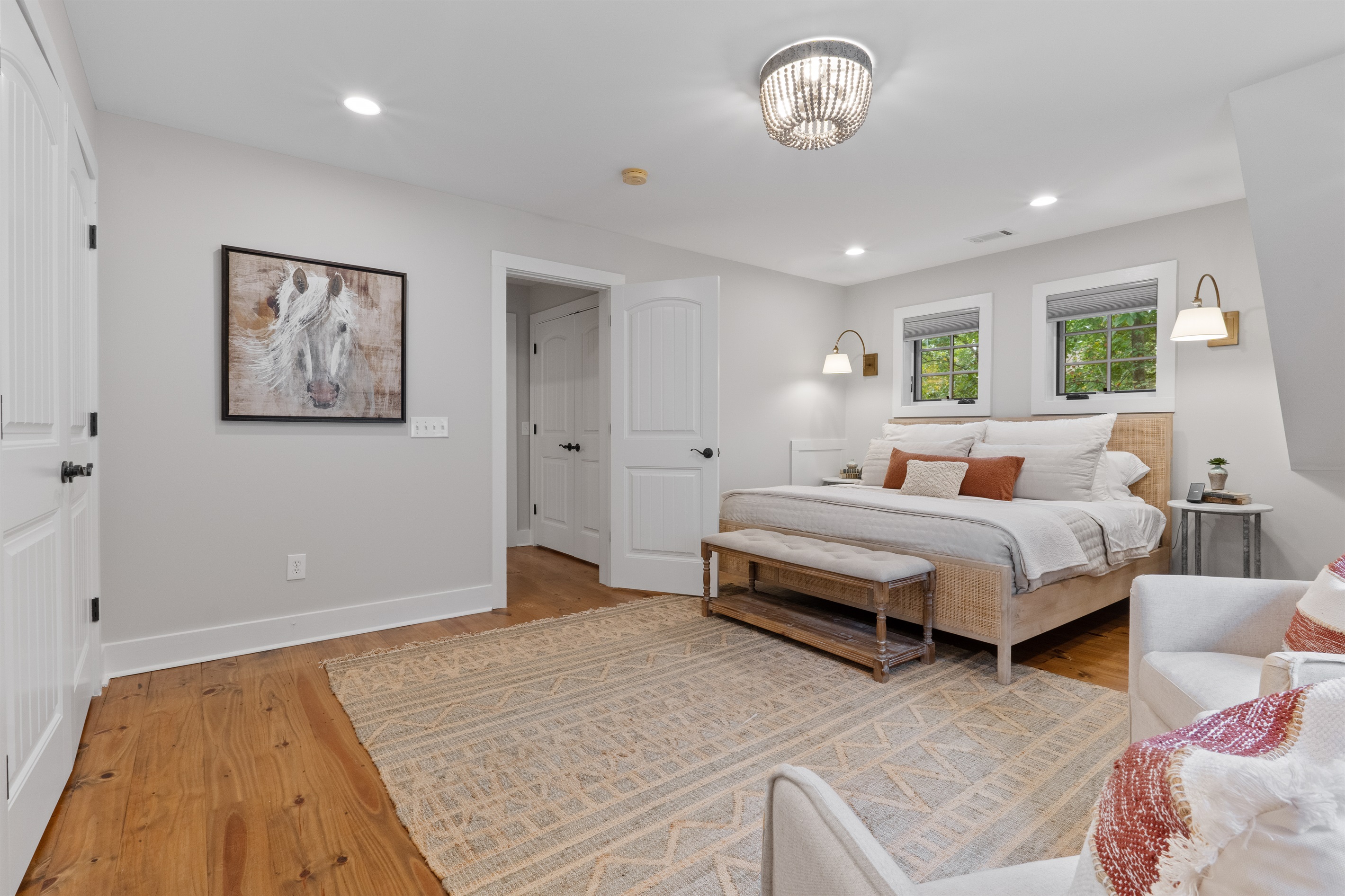 The second bedroom features a king bed with premium bedding, providing a comfortable and restful space for guests.