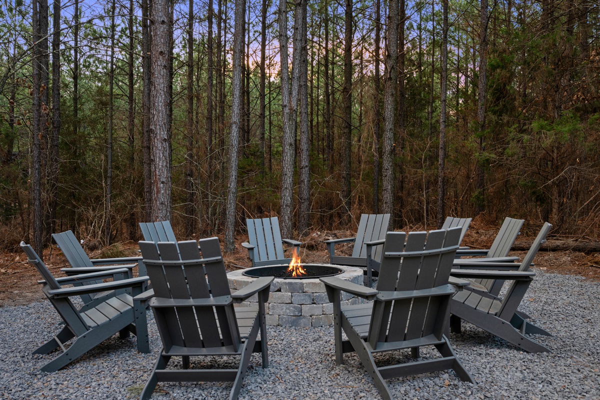 Gather around the fire pit with comfortable seating all around, perfect for roasting marshmallows, sharing stories, and enjoying the night air.
