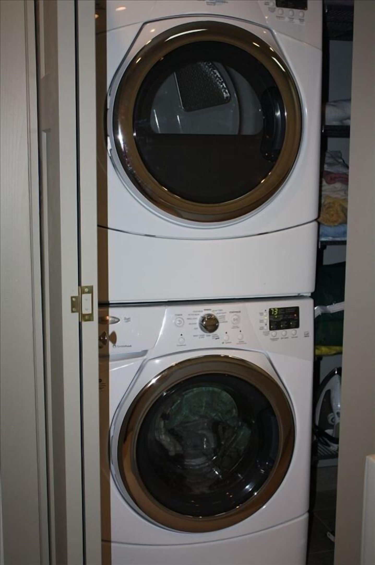 In unit washer and dryer on the bedroom floor