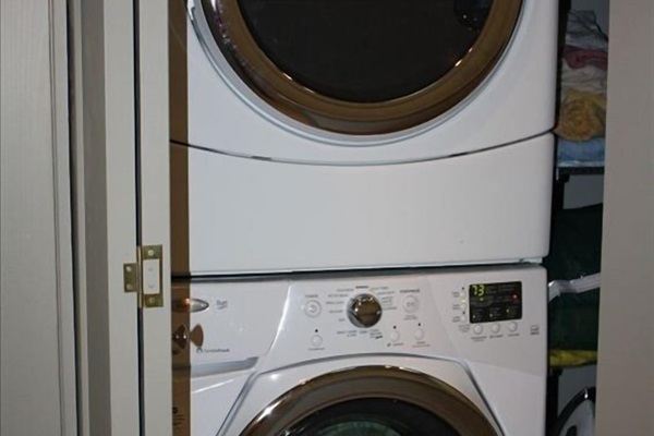 In unit washer and dryer on the bedroom floor