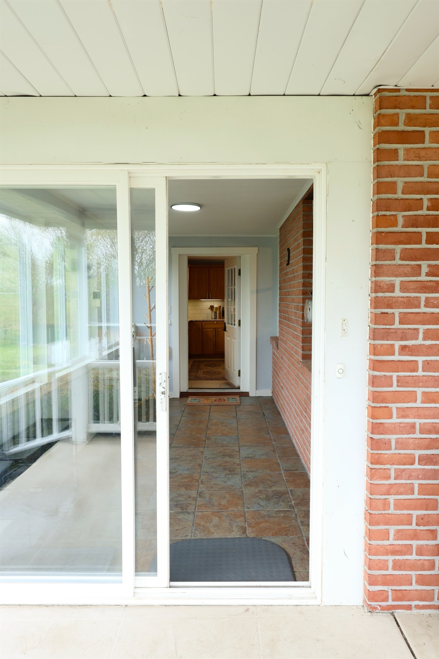 Entry to hold shoes, coats, jackets, luggage, coolers. Leads into kitchen