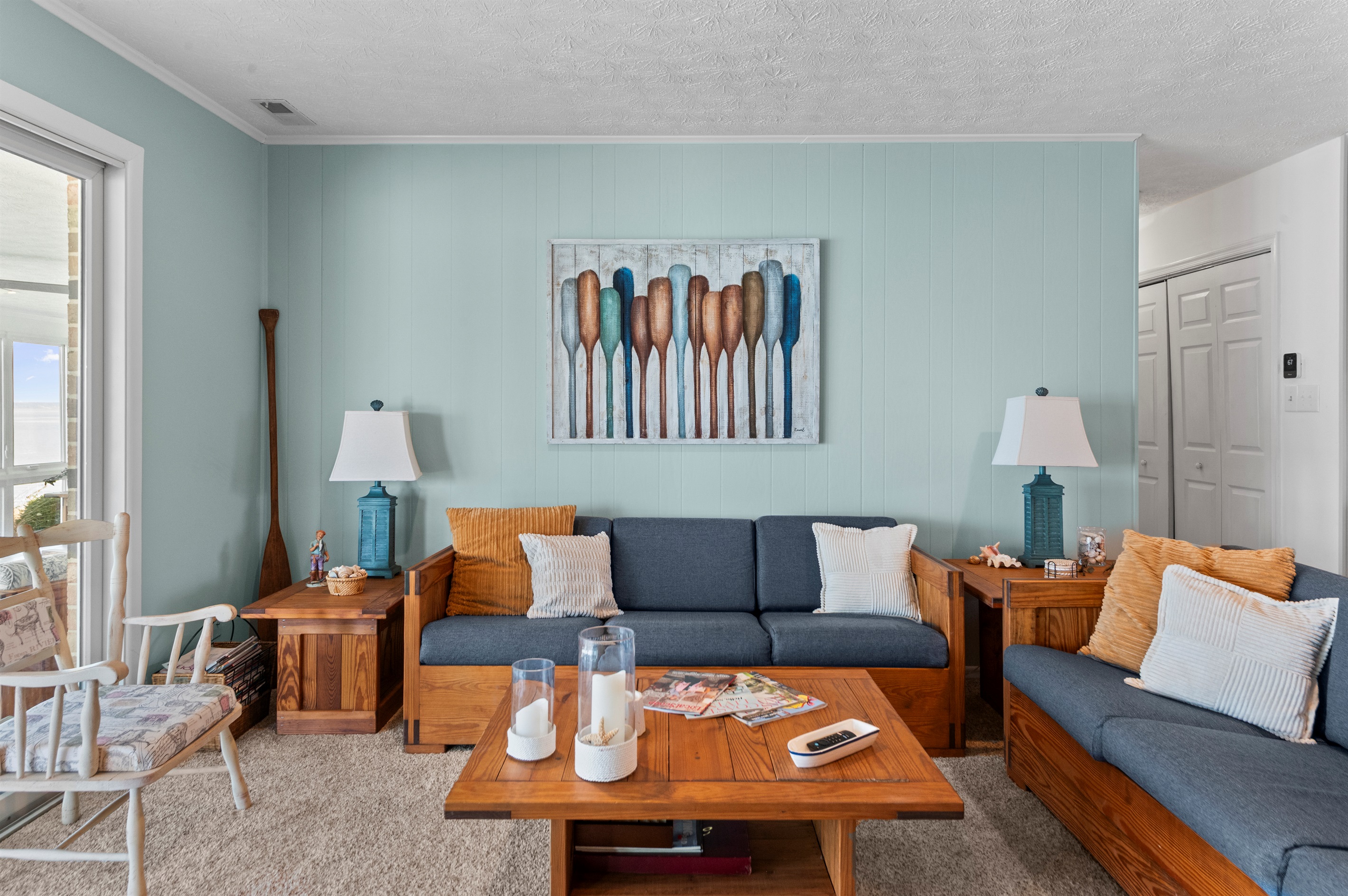 Living Room Retreat: Relax in style with vibrant decor and inviting views! Perfect for gatherings!