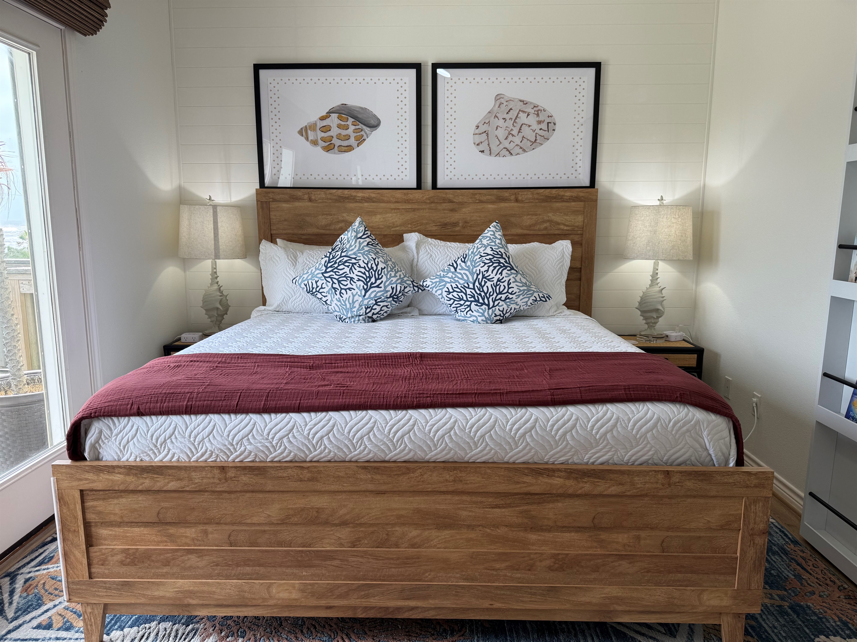 The Shell Bedroom Primary Suite! The is a king bedroom on the main level with a private full bathroom - tub and shower combo.