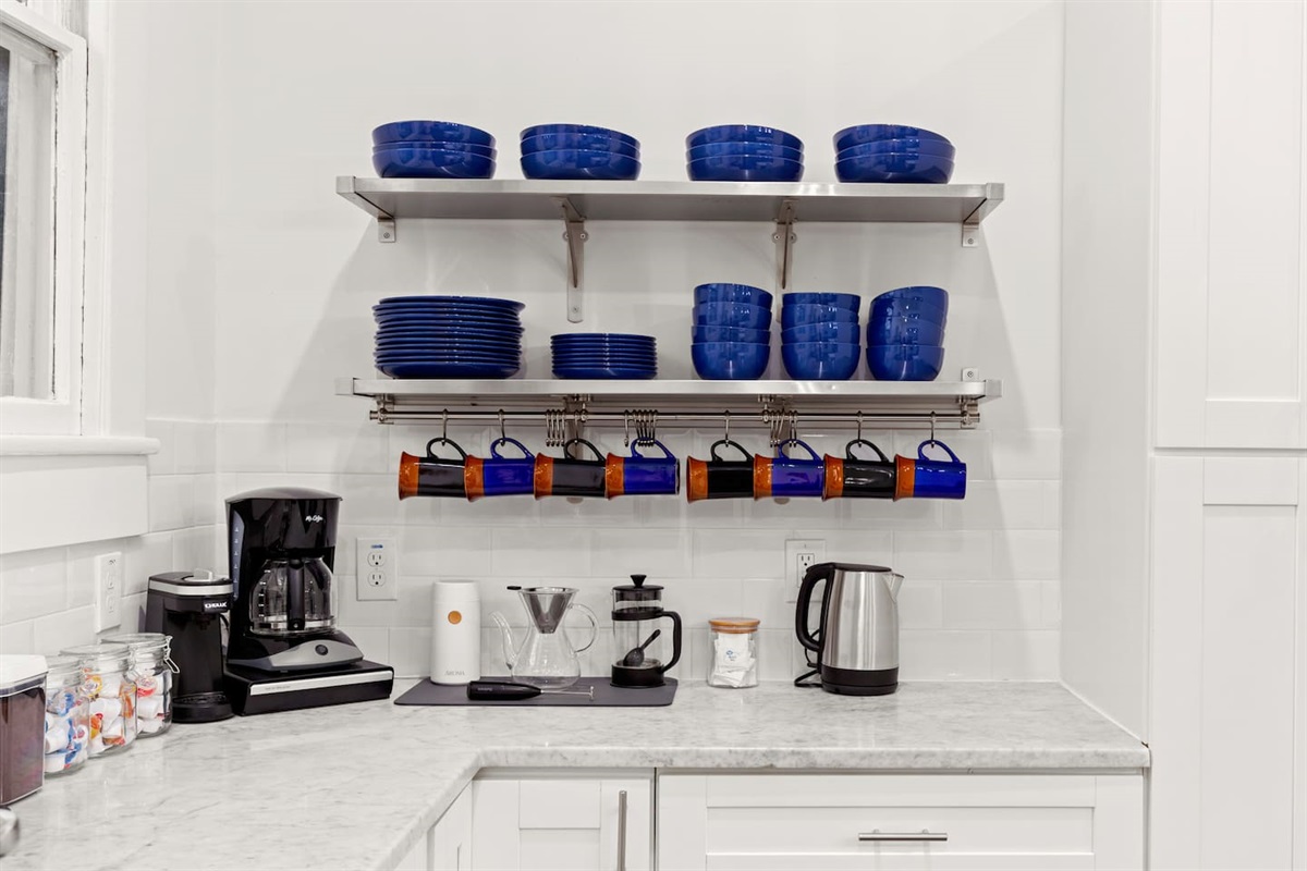 Dive into the details of our kitchen's dedicated coffee corner, where a perfect morning brew awaits to start your day right.