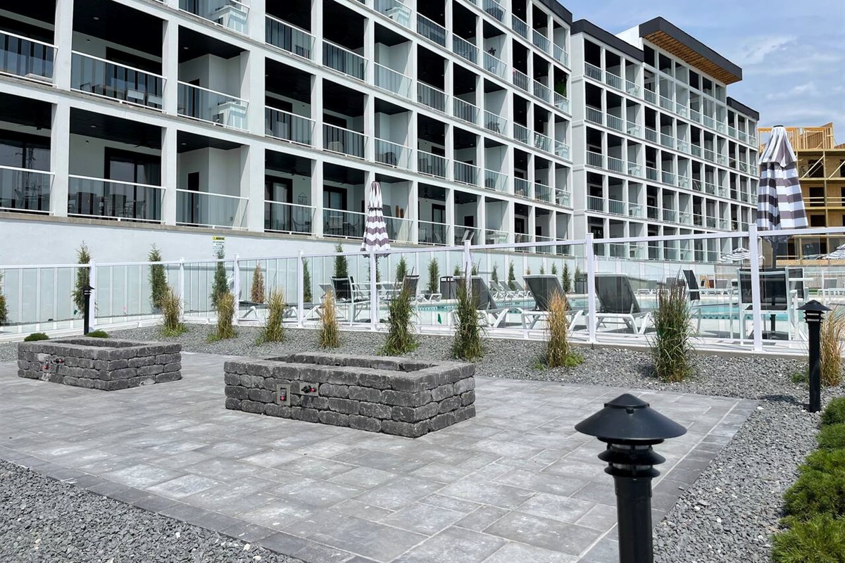 Lighted pathways along the pool and lakeside