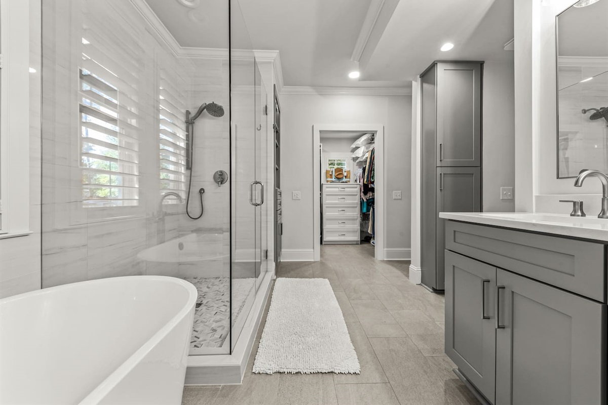 Primary Bathroom with tub and walk-in shower. Double vanity.