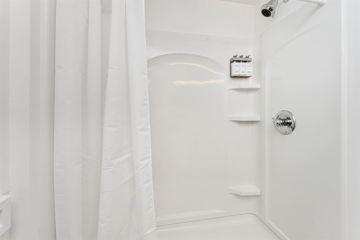 Full-size shower w/ bright, refreshing setup