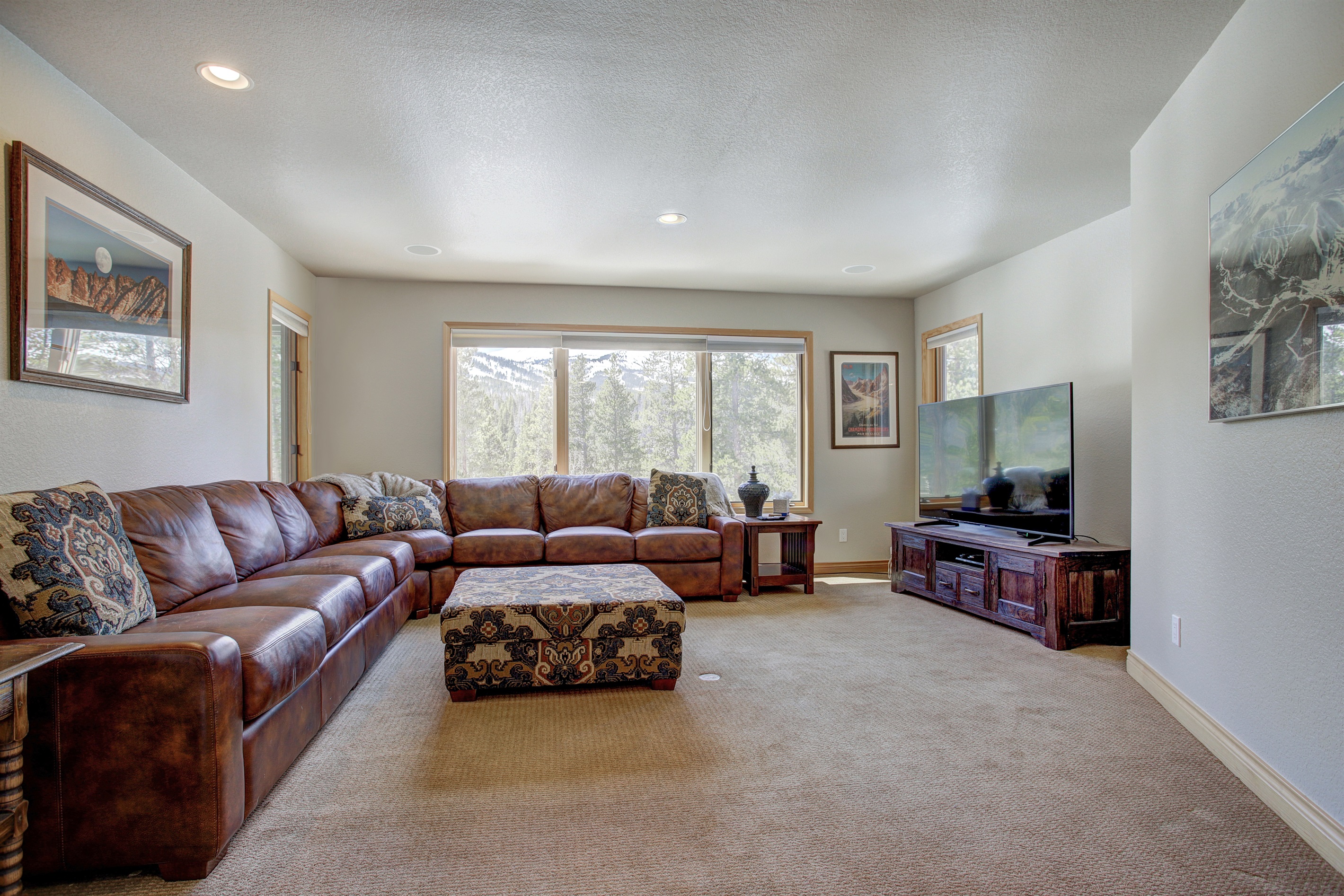 Large couch in lower level Living room.