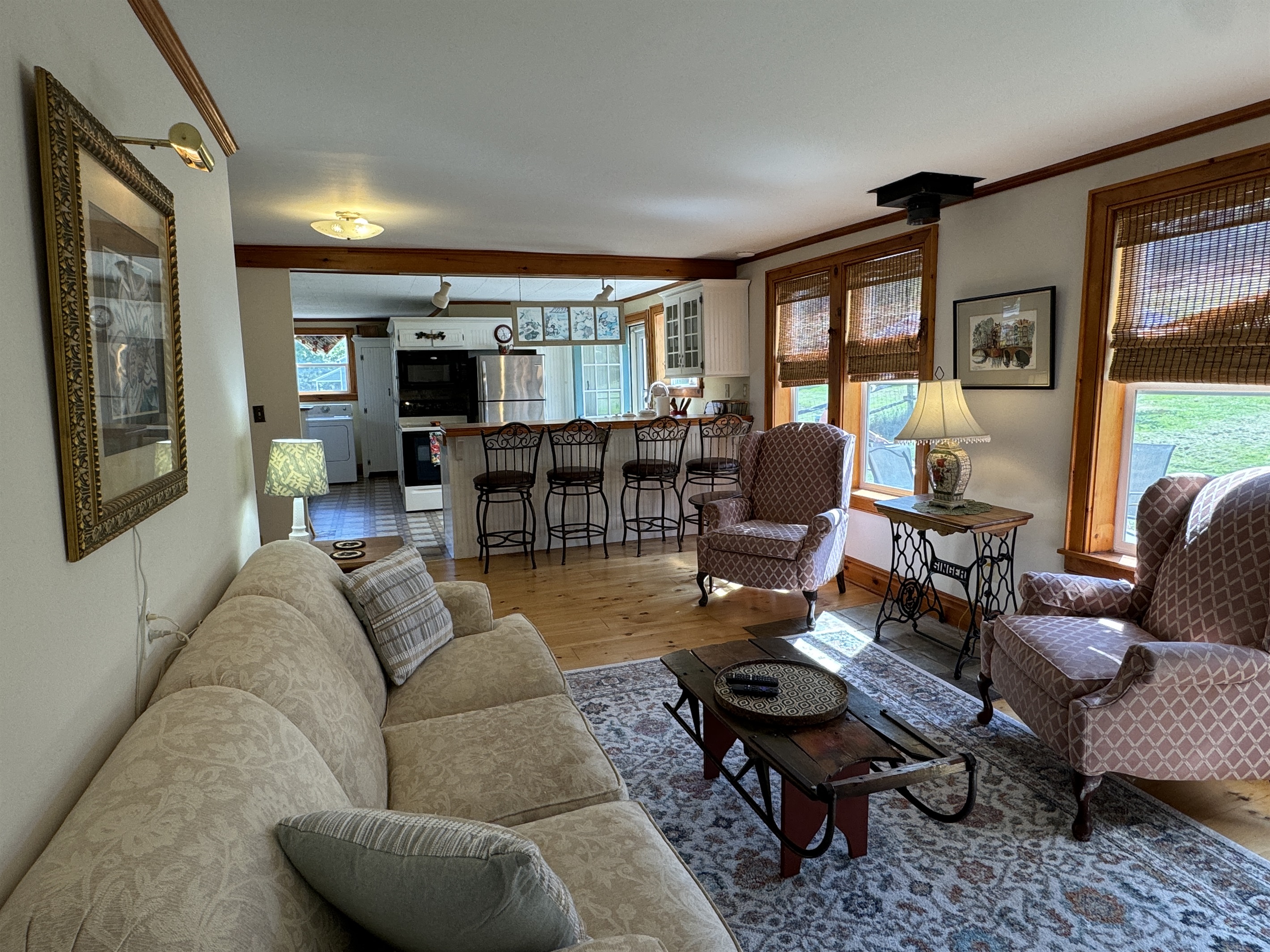 LIving room with kitchen beyond