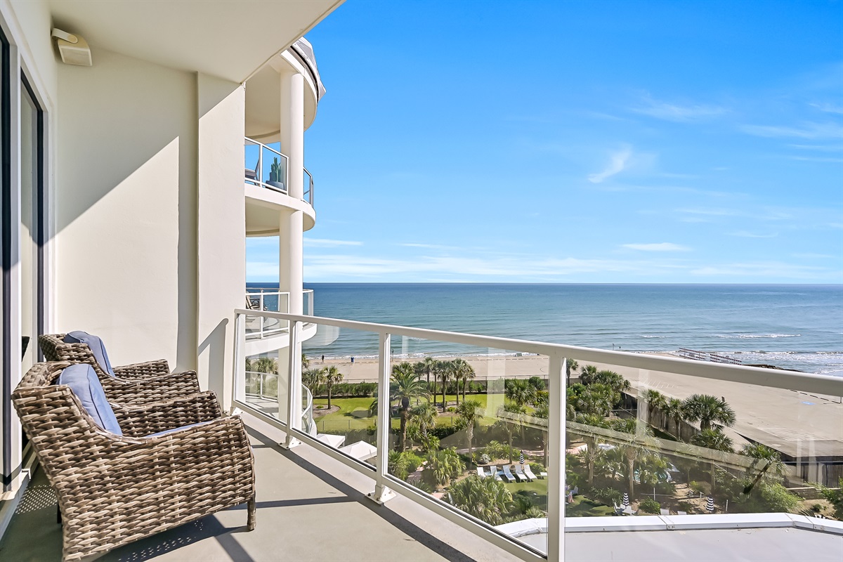 Beachview from balcony with outdoor sofa chairs