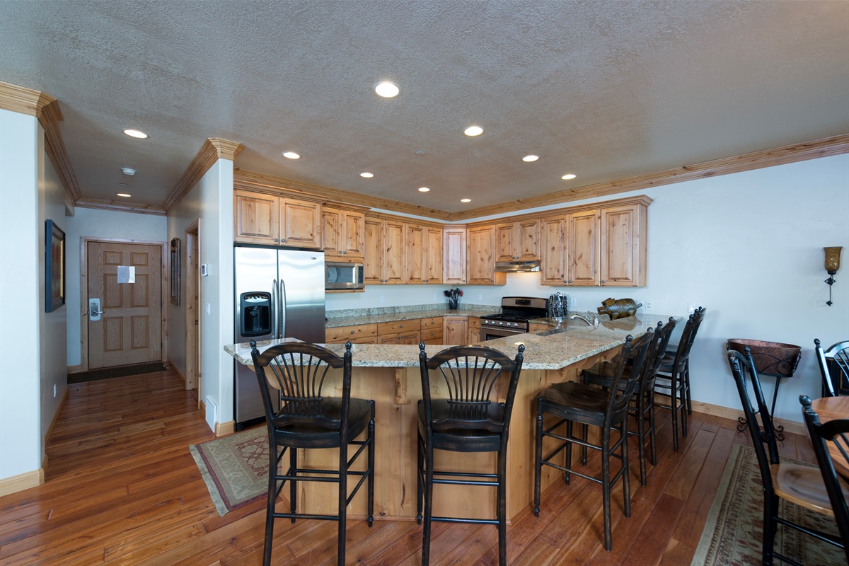 Expansive kitchen and dining layout designed for group meals and connection.