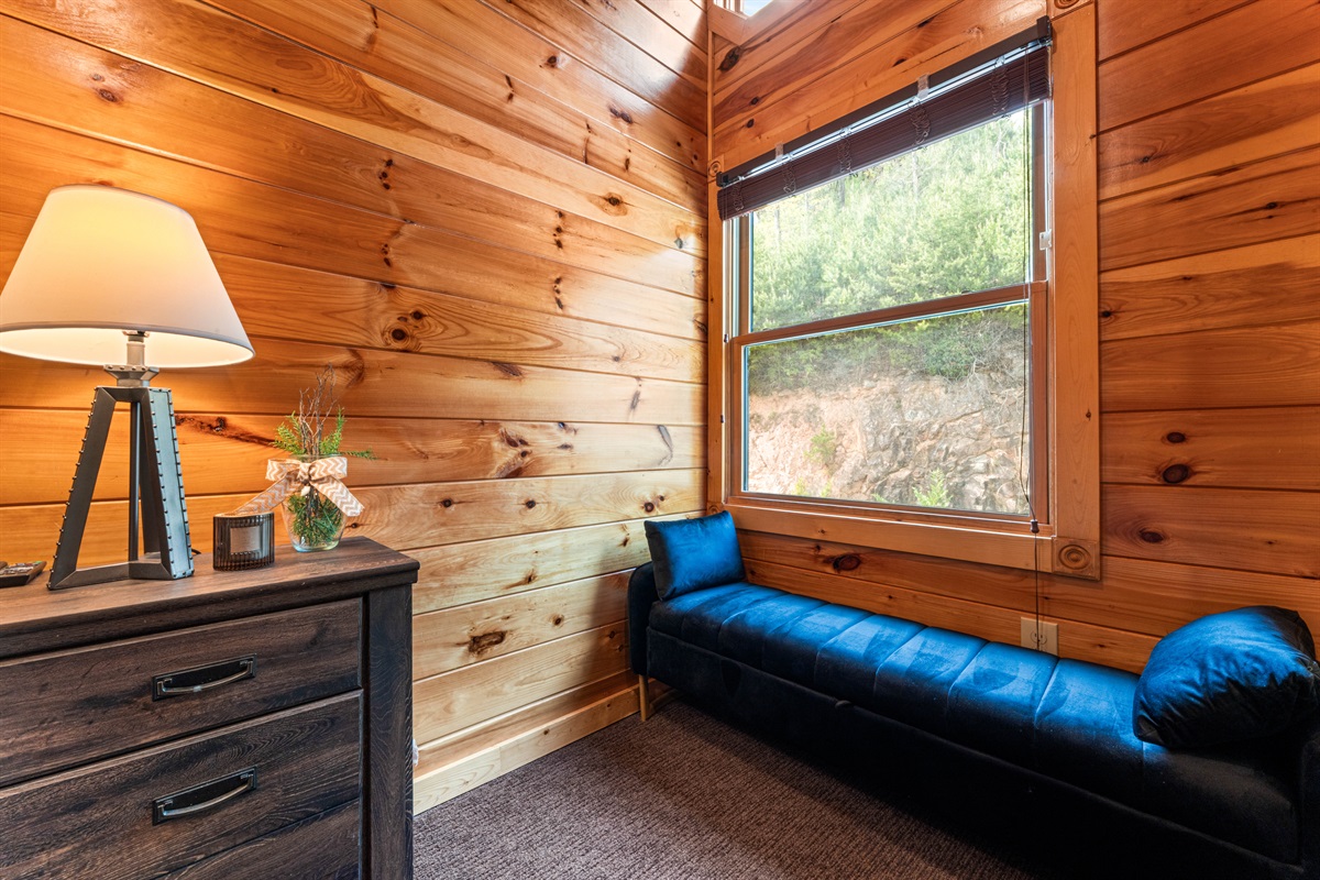 Window bench seat in The Cedar Suite for relaxing.
