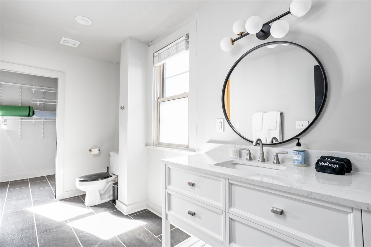 Prepare and unwind in the primary en-suite bathroom.