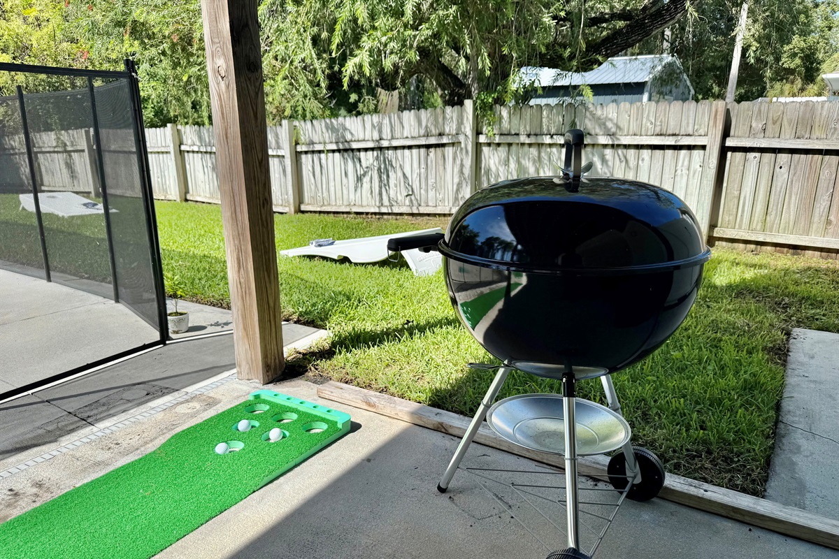 Whether you’re grilling, lounging, or playing games, there’s something for everyone in this backyard.