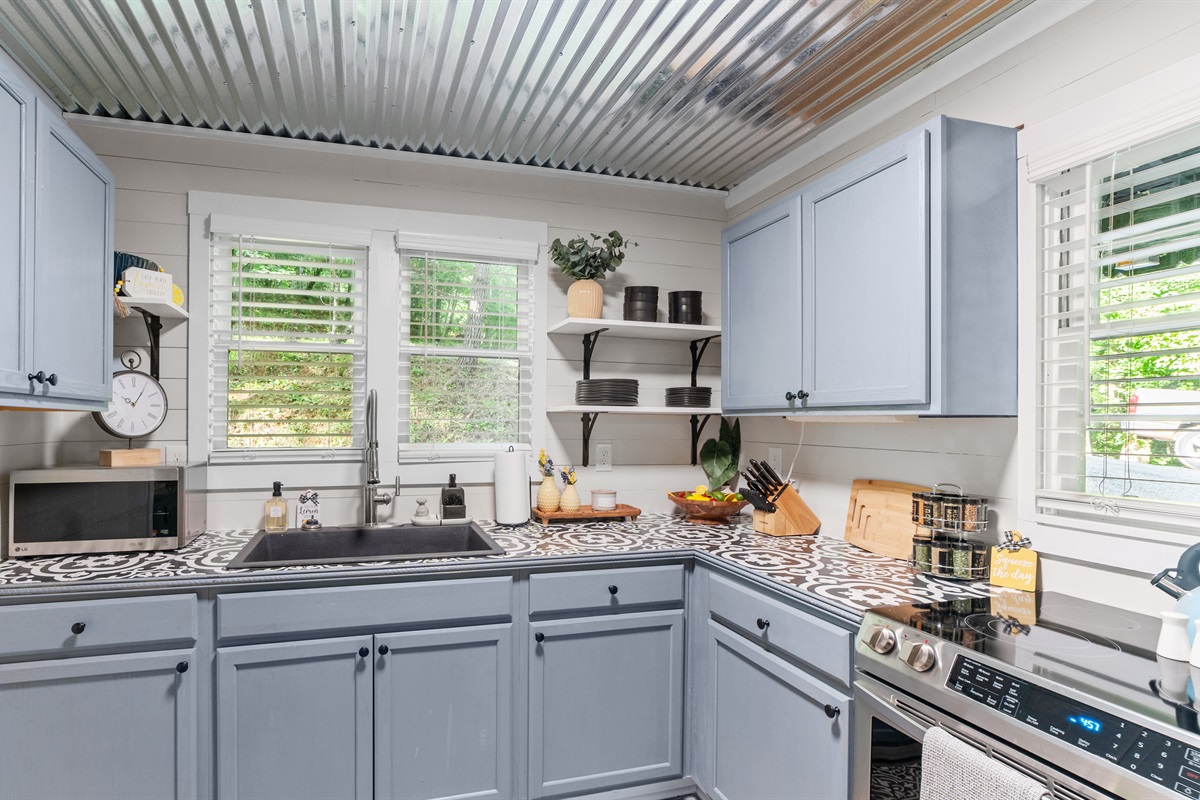 Full kitchen w/ views of the front porch