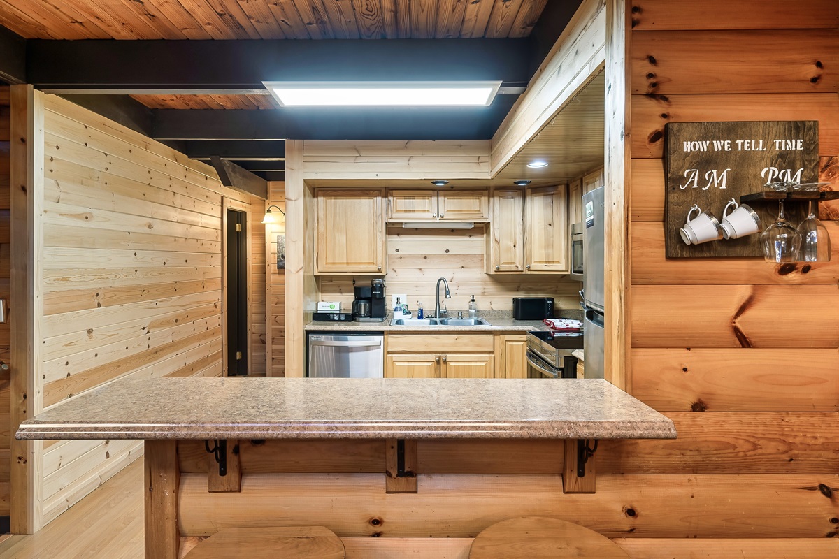 Another view of kitchen with the walkway to main level bedroom, bathroom