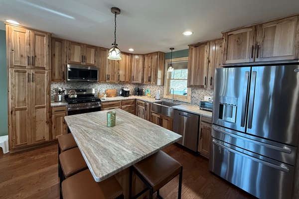 Chef's Kitchen with granite countertops and high-end appliances. 