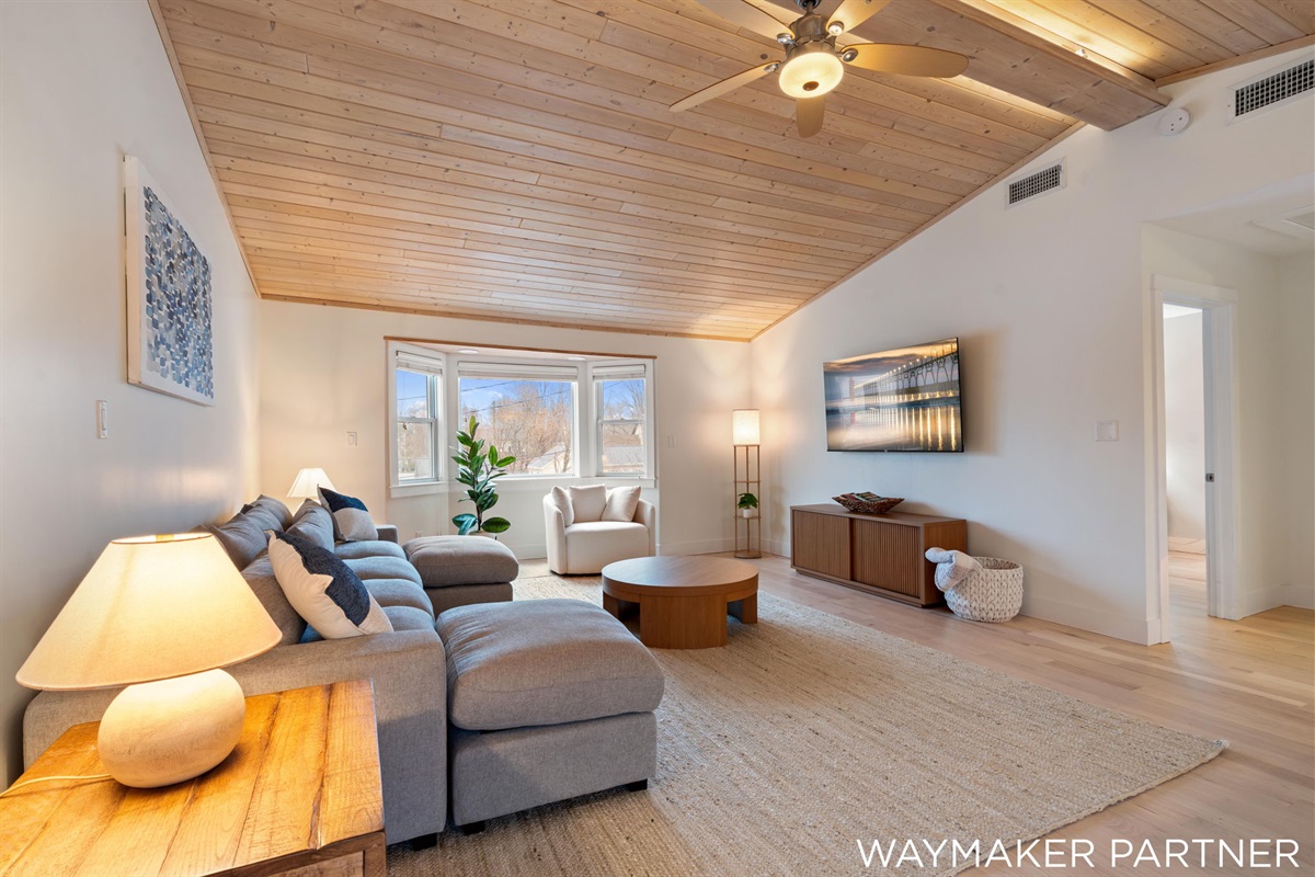 Our 2nd floor has lofted ceilings and a gorgeous family room with plenty of seating.