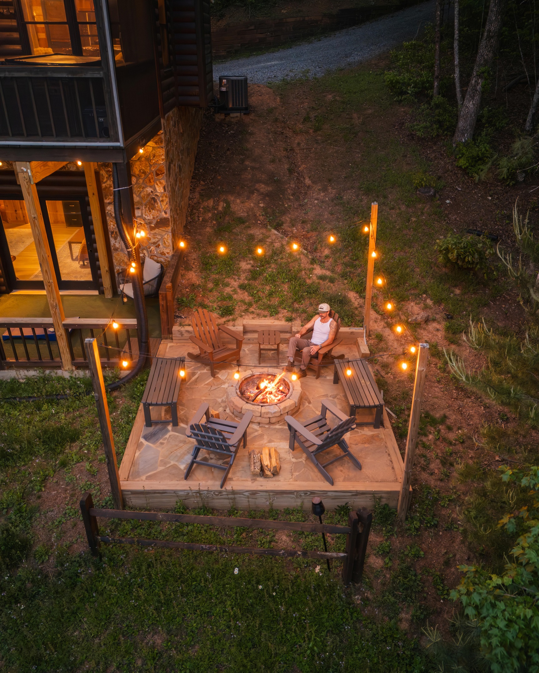 Firepit nights under the stars with string lights and mountain air. The private firepit is conveniently located off of the lower-level deck.