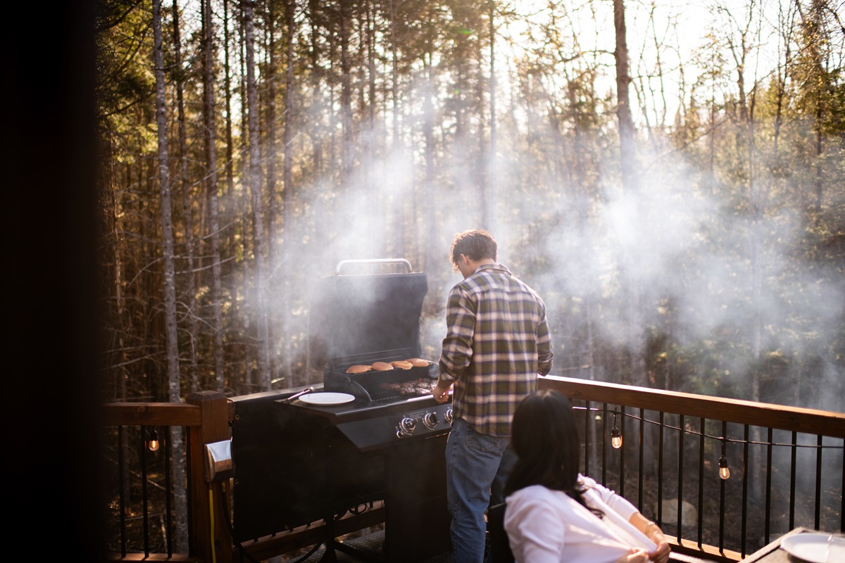 The 4-burner propane grill is ready for you. Because dinner tastes better in the mountains!