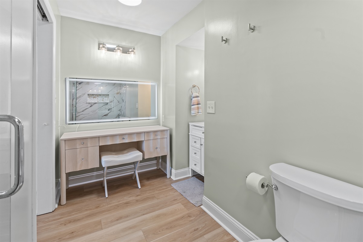 Vanity area in Main Bathroom with large back lit mirror