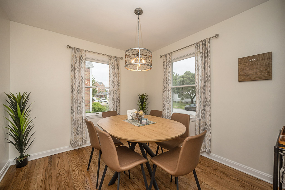 Dining table comfortably seats six for meals or game night. Two additional chairs are located in the closet.