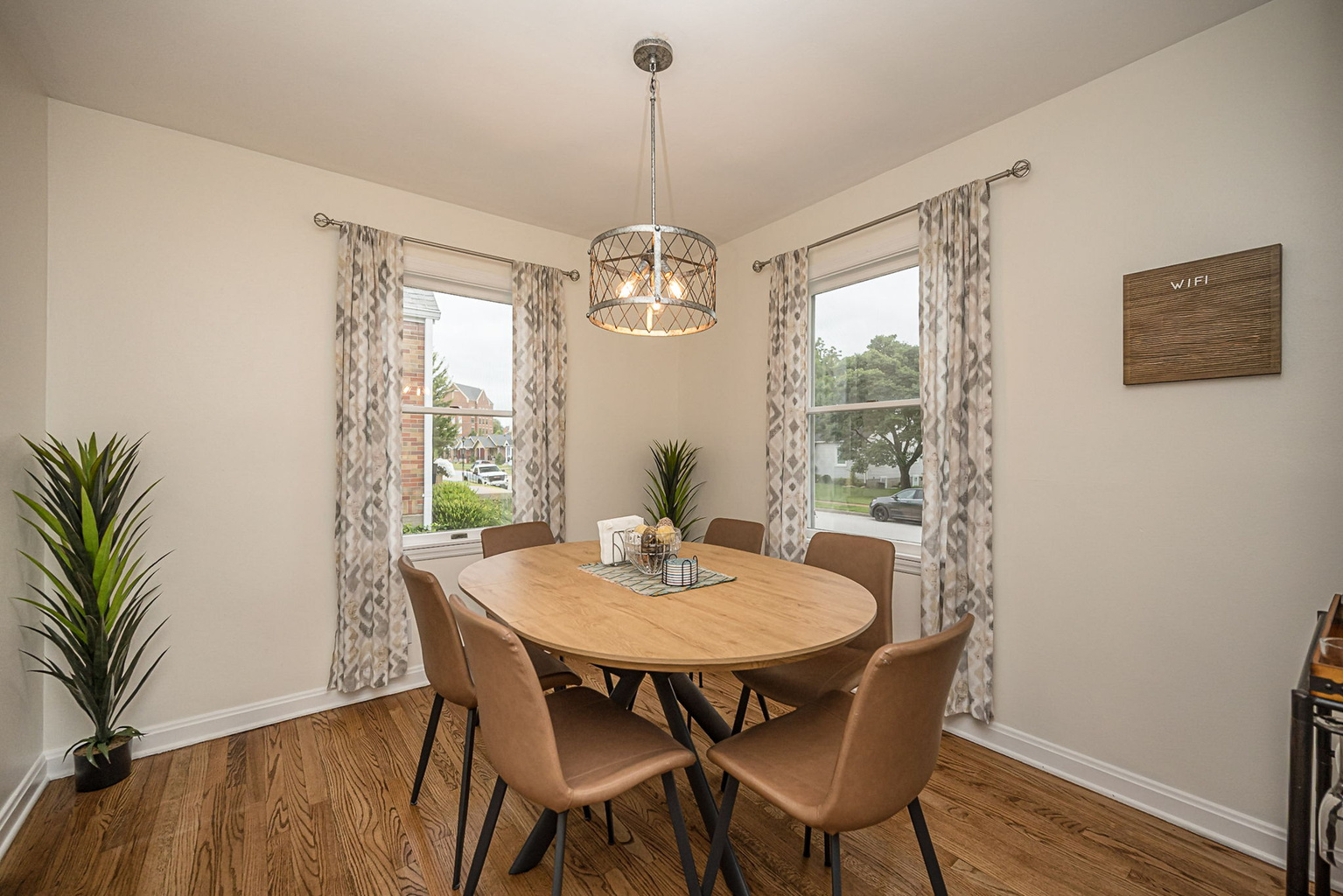 Dining table comfortably seats six for meals or game night. Two additional chairs are located in the closet.