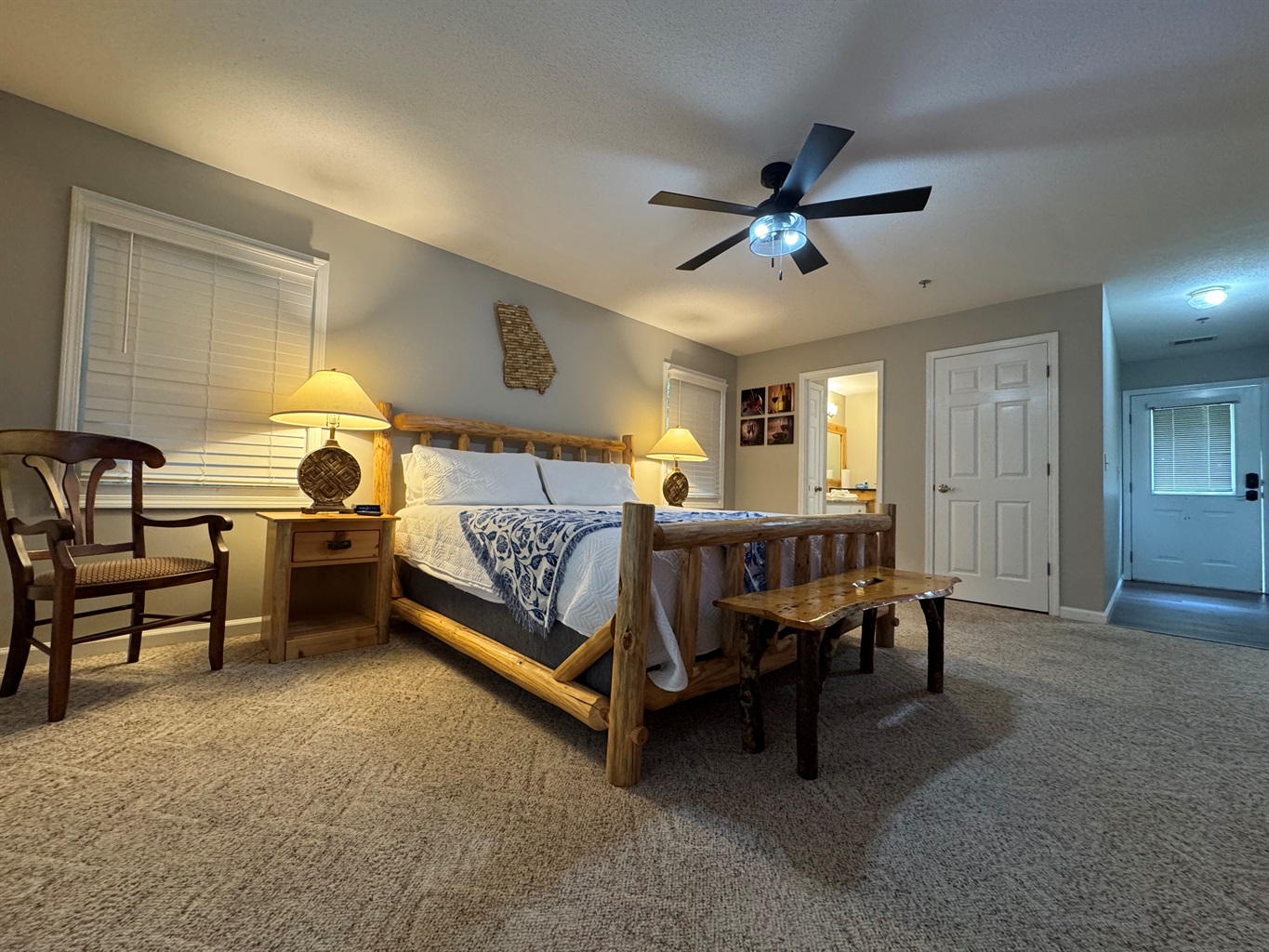 Relax in rustic comfort with a king-size bed, soft lighting, and cozy cabin charm. Step right out onto your private deck and enjoy the peaceful tree-lined views.