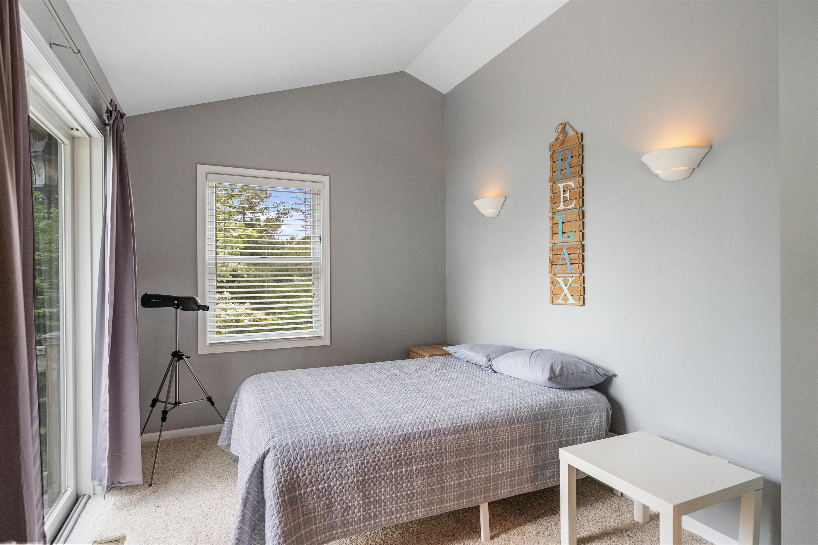 Master bedroom full sized bed with lake view