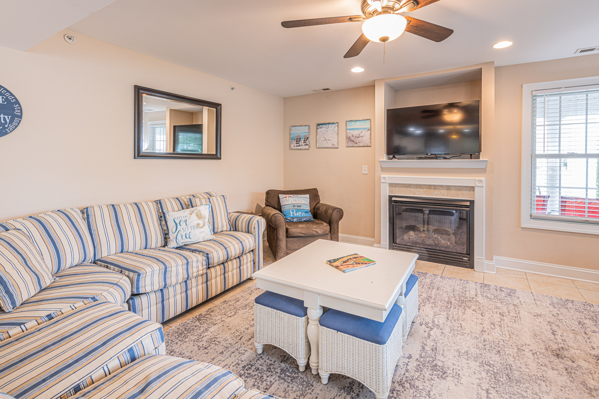 Cozy Living Room with Fireplace and Plush Armchairs