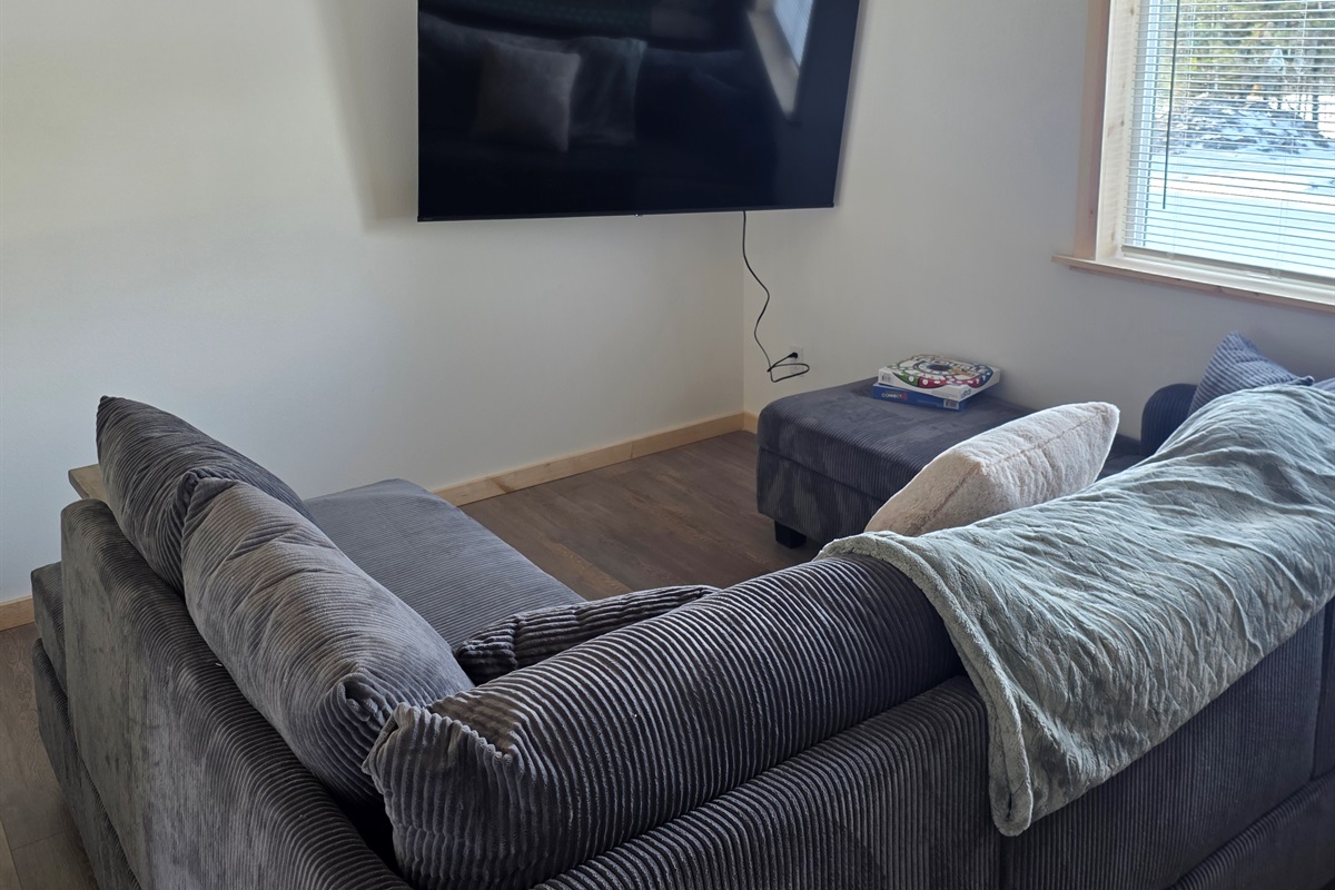 Loft living area - sectional sofa and big screen tv.