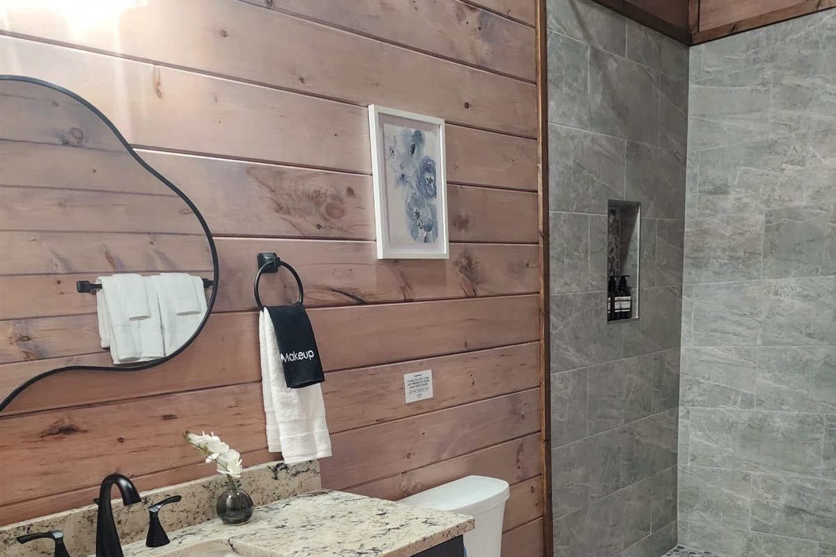 Stylish bathroom with modern vanity and shower
