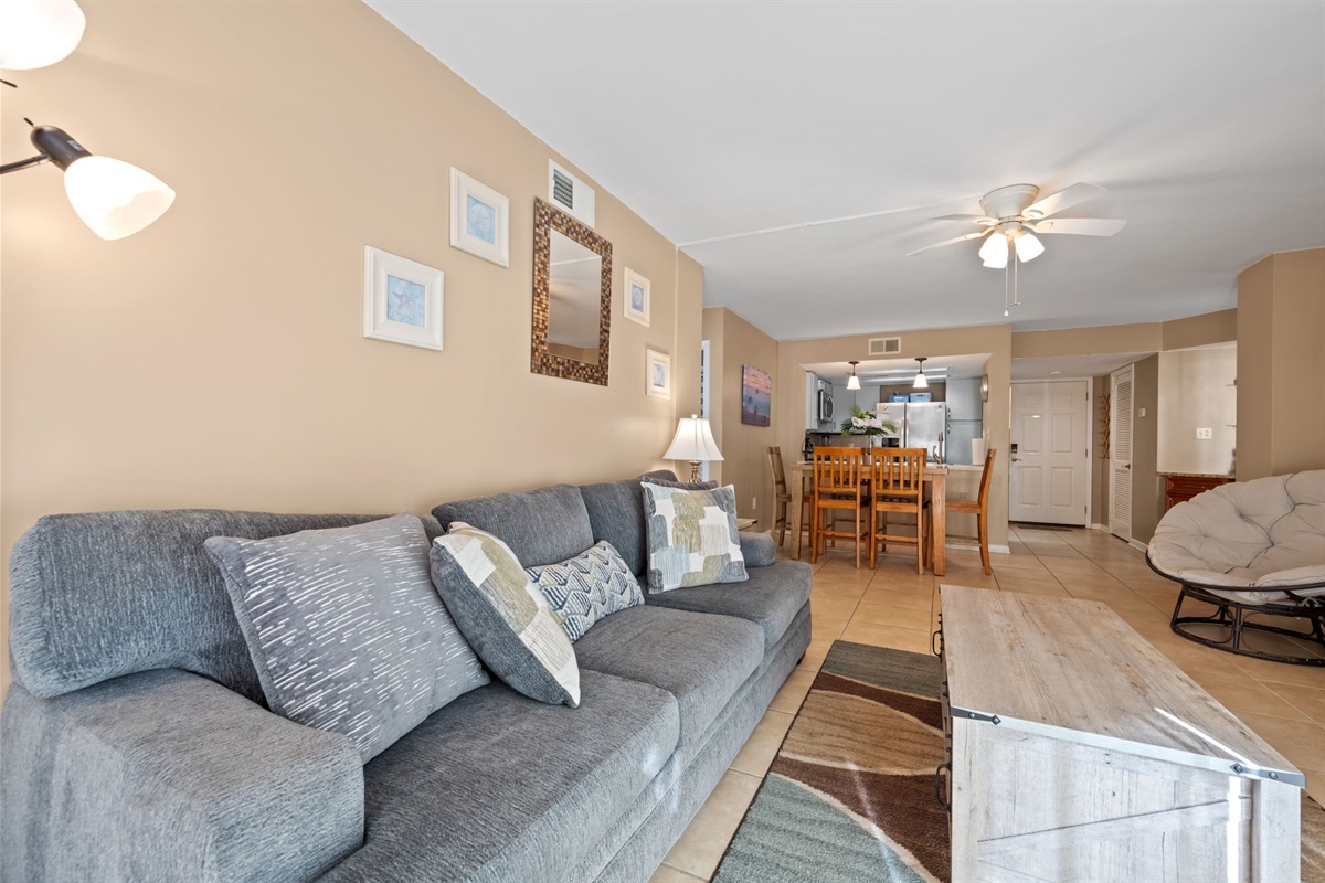 Open-concept living and dining area with comfortable seating, ample space to gather, and easy flow into the kitchen