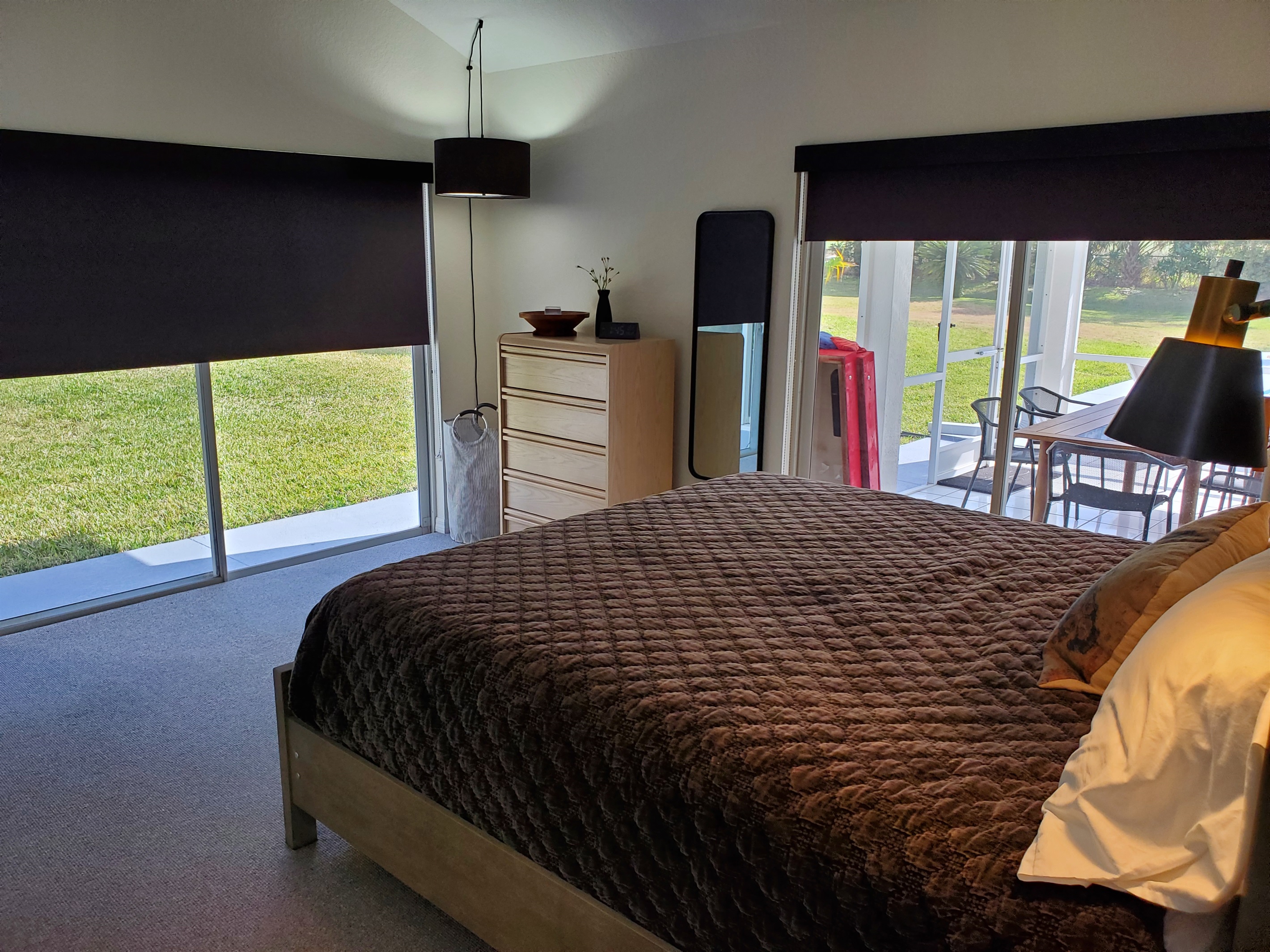 King master bedroom with lanai and backyard access