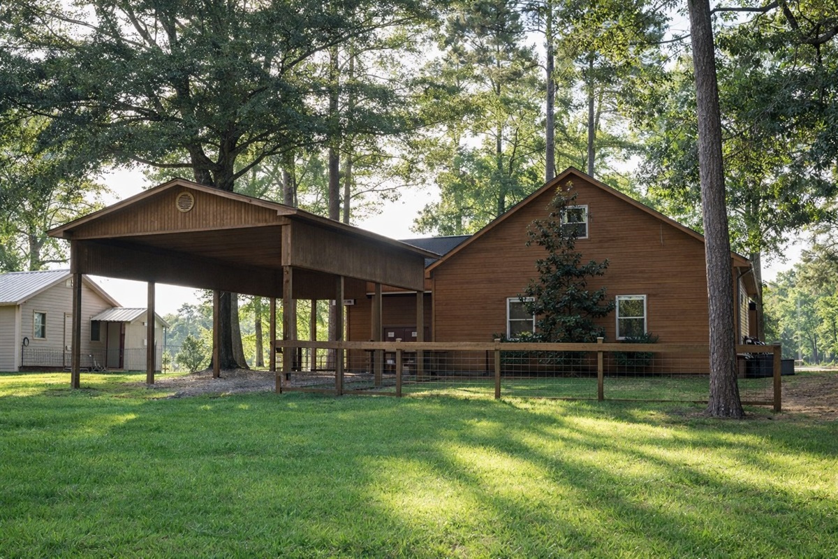 Covered outdoor pavilion with picnic table — shaded lakefront dining.