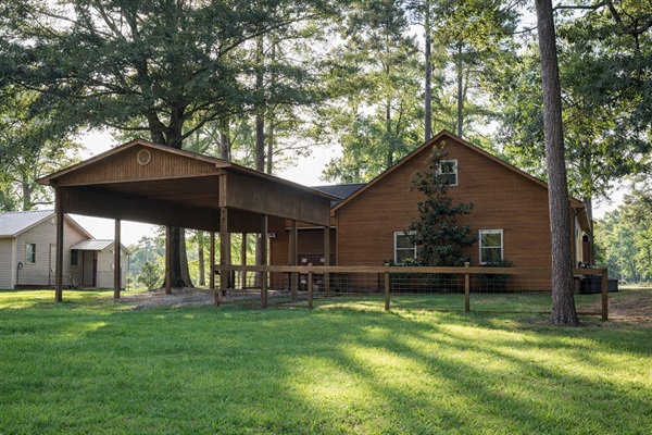 Covered outdoor pavilion with picnic table — shaded lakefront dining.