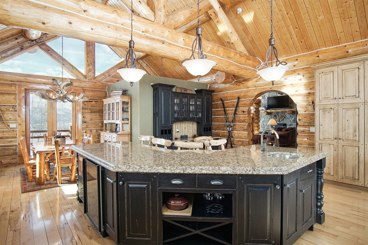 Large kitchen island with seating and beautiful natural light